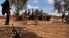 FILE - Free Syrian Army fighters prepare their ammunition during what they said was an offensive against forces loyal to Syria's President Bashar al-Assad in the southern city of Dara'a. 