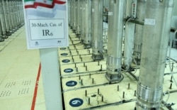FILE - This file photo released Nov. 5, 2019, by the Atomic Energy Organization of Iran, shows centrifuge machines in the Natanz uranium enrichment facility in central Iran.