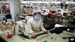 North Korean workers sew items at a factory of a South Korean-owned company at the jointly-run Kaesong Industrial Complex, in Kaesong, North Korea.