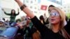 Supporters of Tunisian party Nida Tunis (Tunisia Calls) celebrate their victory in parliamentary elections in Tunis, Tuesday, Oct.28, 2014. 