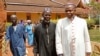 FILE - Archbishop of Bangui Dieudonne Nzapalainga (R) walks with imam Oumar Kobine Layama (2nd R), representative of the local Muslim community, in Bangui Feb. 10, 2014.