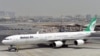 FILE - Sebuah Airbus A340 milik Mahan Air di landasan Bandara Internasional Dubai, 14 September 2017.