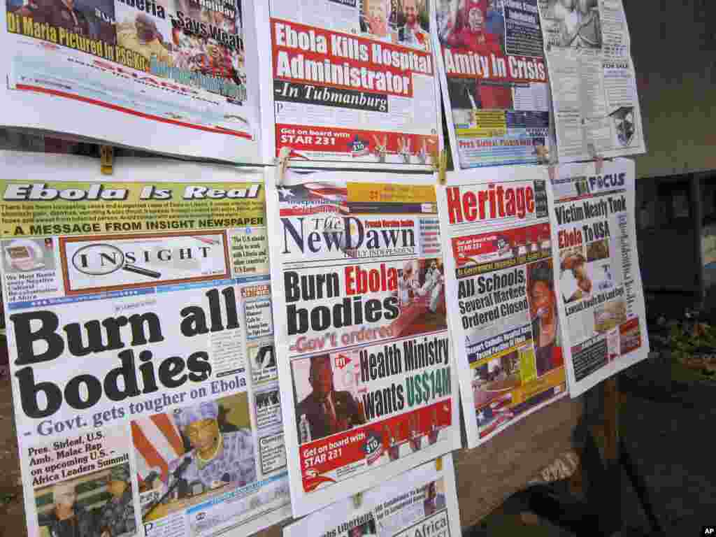 Newspaper headlines prominently display the Ebola outbreak, this headline reads 'Burn all bodies' in the city of Monrovia, Liberia, July 31, 2014.