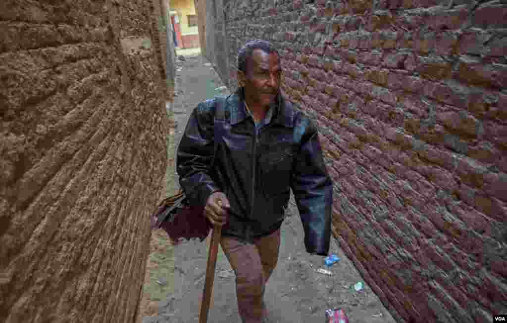 Abdallah also can walk by himself. "I count my steps, and I know about the directions and landmarks, if I go anywhere for only once, I could go back on my own," he says. (Hamada Elrasam/VOA)