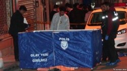 FILE - Turkish police inspect the scene in Istanbul where Tajikistan opposition leader Umarali Kuvvatov was shot from close range, March 5, 2015.
