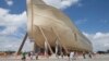 Visitors pass outside the front of a replica Noah's Ark at the Ark Encounter theme park in Williamstown, Kentucky, July 5, 2016. 