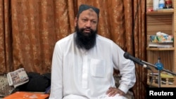 FILE - Leader of the Lashkar-e-Jhangvi (LeJ) Malik Ishaq speaks during an interview with Reuters at his home in Rahim Yar Khan in southern Punjab province October 9, 2012.