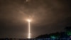 FILE - A Long March 5 rocket carrying China's Chang'e-5 lunar probe launches from the Wenchang Space Center on China's southern Hainan Island, November 24, 2020, on a mission to bring back lunar rocks.