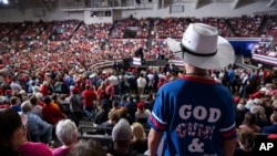 FILE - Supporters of President Donald Trump listen as he speaks during a campaign rally at the Monroe Civic Center, Nov. 6, 2019, in Monroe, La.