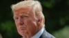 President Donald Trump looks toward members of his staff during a White House news conference in Washington, July 25, 2017.