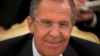 FILE - Russian Foreign Minister Sergey Lavrov smiles as he listens to his Egyptian counterpart, Nabil Fahmy, unseen, during talks in Moscow, Russia.