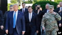 FILE - In this June 1, 2020 file photo, President Donald Trump departs the White House to visit outside St. John's Church, in Washington.