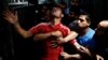 Palestinian men grieve inside the morgue in Gaza City July 16, 2014.