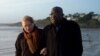 Franco-Togolese dual national politician Kofi Yamgnane walks with his wife Anne-Marie on the beach of Saint-Nic, western France, on 14 Nov 2009