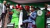 Patience Jonathan (C), wife of Nigeria's President Goodluck Jonathan, dances with supporters during a rally by Jonathan's ruling People's Democratic Party, March 14, 2015. 