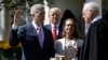 President Donald Trump watches as Supreme Court Justice Anthony Kennedy administers the judicial oath to Judge Neil Gorsuch during a re-enactment in the Rose Garden of the White House White House in Washington, April 10, 2017. 