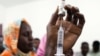 FILE - Staff members of the Teaching Hospital receive the first vaccination treatment for yellow fever in El Geneina, West Darfur in this Nov. 14, 2012 handout. 