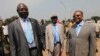 FILE - Martin Ziguele, left, former Central African Republic prime minister, and Nicolas Tiangaye, right, appear at the Bangui airport Jan. 7, 2013. Both are candidates in the next presidential race. 