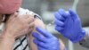 Survivors Struggle as Scientists Race to Solve COVID Mystery 