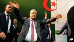 Governing FLN party chief Amar Saadani waves to supporters during a rally held in Algiers, Algeria, March 30, 2016.
