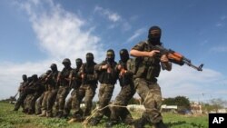 Masked militants from Islamic Jihad are seen during a training exercise, (File photo).