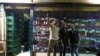 Young Egyptian men take a selfie photograph in front of one of the local liquor stores as they celebrate its reopening on the last day of Ramadan, in Cairo, Egypt, June 5, 2016. Liquor is legally prohibited for Egyptians in Egypt during the holy month of Ramadan.