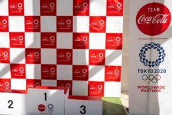 FILE - A banner advertising Coca-Cola, Olympic Games partner for Tokyo 2020, is pictured at the J-village compound, in Fukushima prefecture, Japan, March 12, 2020.