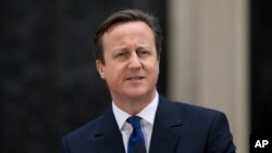 British Prime Minister David Cameron at 10 Downing Street in London, as he makes a speech after arriving back from visiting Britain's Queen Elizabeth II, March 30, 2015.