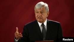 FILE - Mexican President Andres Manuel Lopez Obrador holds a news conference at the National Palace in Mexico City, Dec. 3, 2018. 