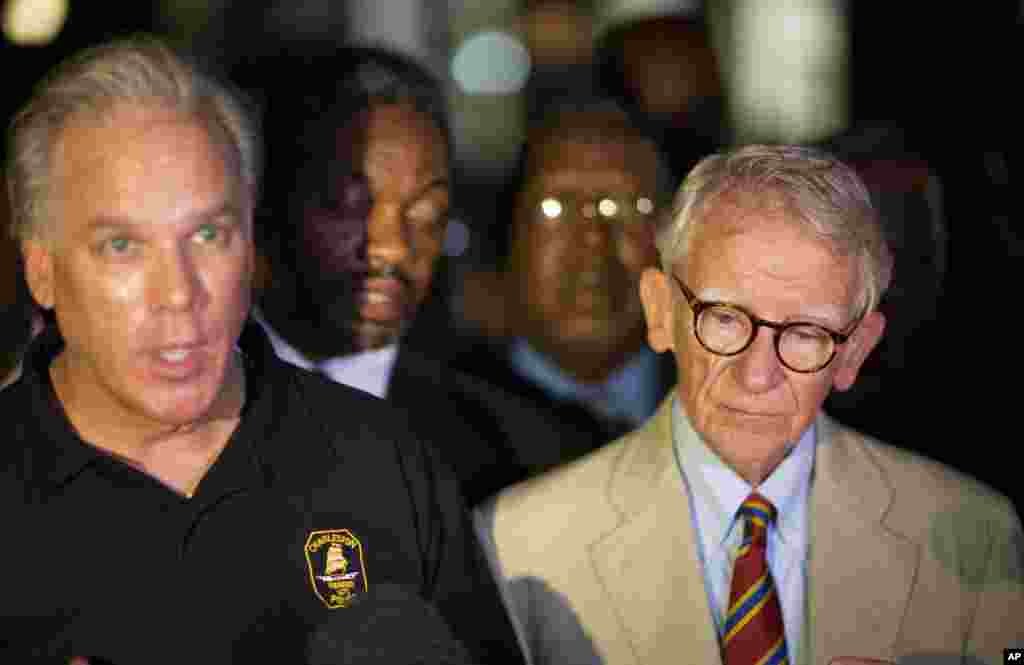 Charleston Mayor Joseph Riley, right, stands next to Police Chief Gregory Mullen as he addresses the media down the street from the Emanuel AME Church early Thursday, June 18, 2015 following a shooting Wednesday night in Charleston, S.C.