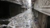 Children walk down a street in Aleppo, Syria, Feb. 12, 2016.