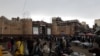 People shop outside the gates to the Old City in Sana'a on May 7, 2020.
