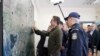 FILE - Greece's Prime Minister Kyriakos Mitsotakis points a map in the village of Feres, Evros region, at the Greek-Turkish border, March 3, 2020.