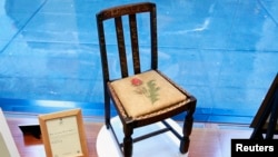 A chair used by British author J.K. Rowling while writing "Harry Potter and the Sorcerer's Stone" and "Harry Potter and the Chamber of Secrets" is shown in the window of Heritage Auctions in New York, April 4, 2016. 
