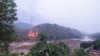 This handout from Kawthoolei Today taken and released on April 27, 2021 shows fires burning at a Myanmar military base along the bank of the Salween river, as seen from Mae Sam Laep town in Thailand's Mae Hong Son province, after the base was attacked and