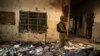 An army soldier stands in the Army Public School, which was attacked by Taliban gunmen, in Peshawar, Dec. 17, 2014. Taliban gunmen in Pakistan took hundreds of students and teachers hostage. More than 140 people died in the massacre. Umar Mansoor was reportedly the mastermind behind the attack. 