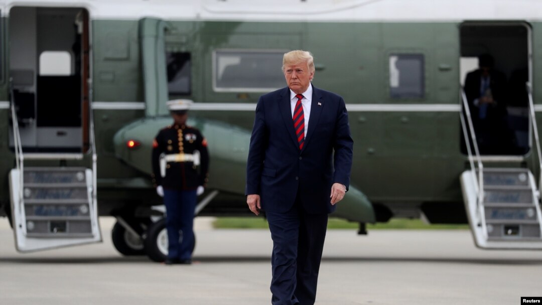 U.S. President Donald Trump walks from the Marine One presidential helicopter prior to departing O'Hare International Airport in Chicago, Illinois, U.S., October 28, 2019. REUTERS/Leah Millis