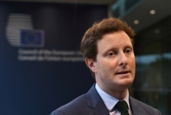 FILE - French minister for European affairs Clement Beaune arrives at a General Affairs meeting in Luxembourg, June 22, 2021.