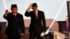 Capres No. 02 Prabowo Subianto (kiri) bersama Cawapres Sandiaga Uno melambai kepada hadirin sebelum acara Debat Capres perdana, Kamis malam (17/1).