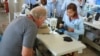 Factory Boss Seeks to Empower His Cambodian Workers