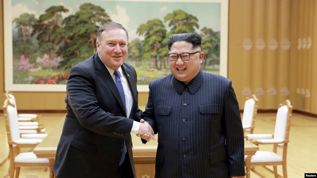 FILE - North Korean leader Kim Jong Un shakes hands with U.S. Secretary of State Mike Pompeo, May 9, 2018, released by North Korea's Korean Central News Agency (KCNA) in Pyongyang.