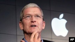 FILE – Apple CEO Tim Cook.