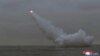 Korea Utara menembakkan rudal dari sebuah kapal selam, menyasar target di bawah laut, di lokasi yang tidak disebutkan pada 12 Maret 2023. (Foto: KCNA via Reuters)