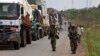 African Union peacekeepers guard a commercial convoy making its way to the border of Cameroon, near Bangui, Central African Republic, March 8, 2014.