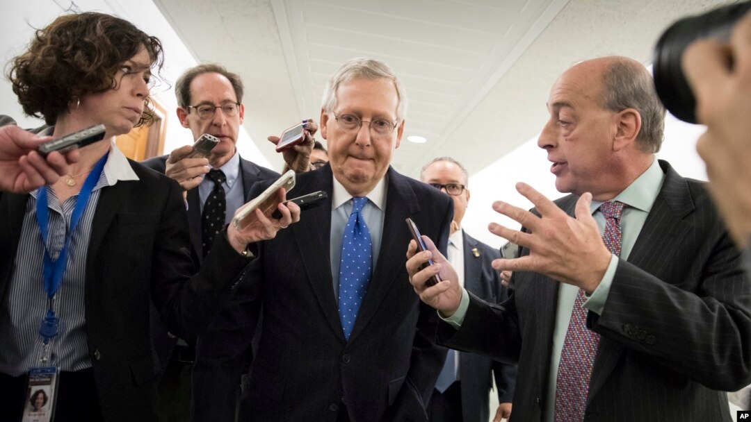 Senate Majority Leader Mitch McConnell, R-Ky., is surrounded by reporters as Republicans work to pass their tax bill, on Capitol Hill in Washington, Nov. 30, 2017.