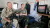 Ukrainian soldiers watch inauguration ceremony of Ukrainian President-elect Petro Poroshenko on TV near Slovyansk, June 7, 2014.