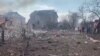 The aftermath of artillery shelling by Russia is seen on a residential area, in Mariupol