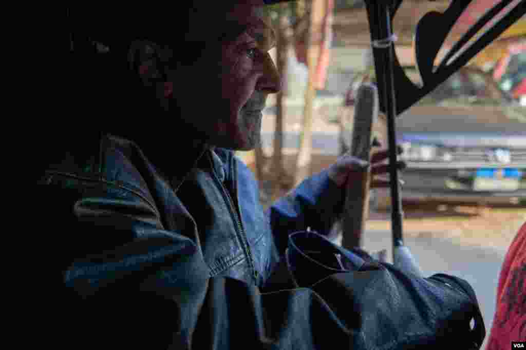 Abdallah knows how to get to clients' places on his own, whether by walking or taking public transport. (Hamada Elrasam/VOA)